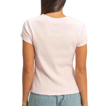 Person wearing a light pink t-shirt and light blue shorts on a plain background