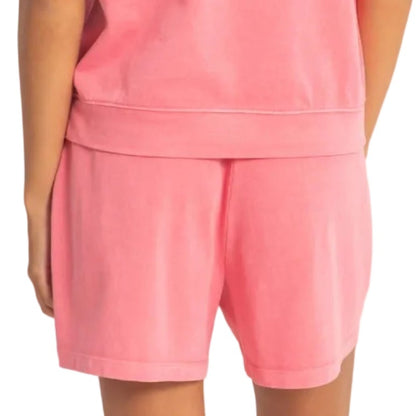 Person wearing a pink outfit on a white background