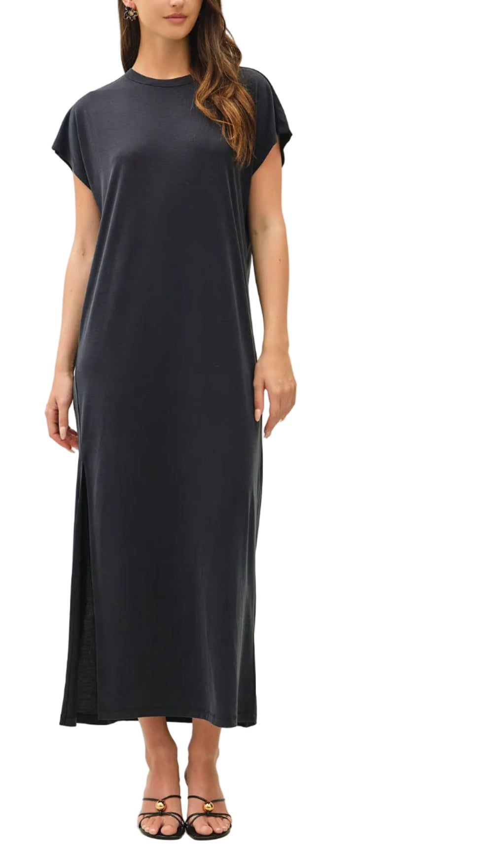 Woman wearing a black dress against a white background