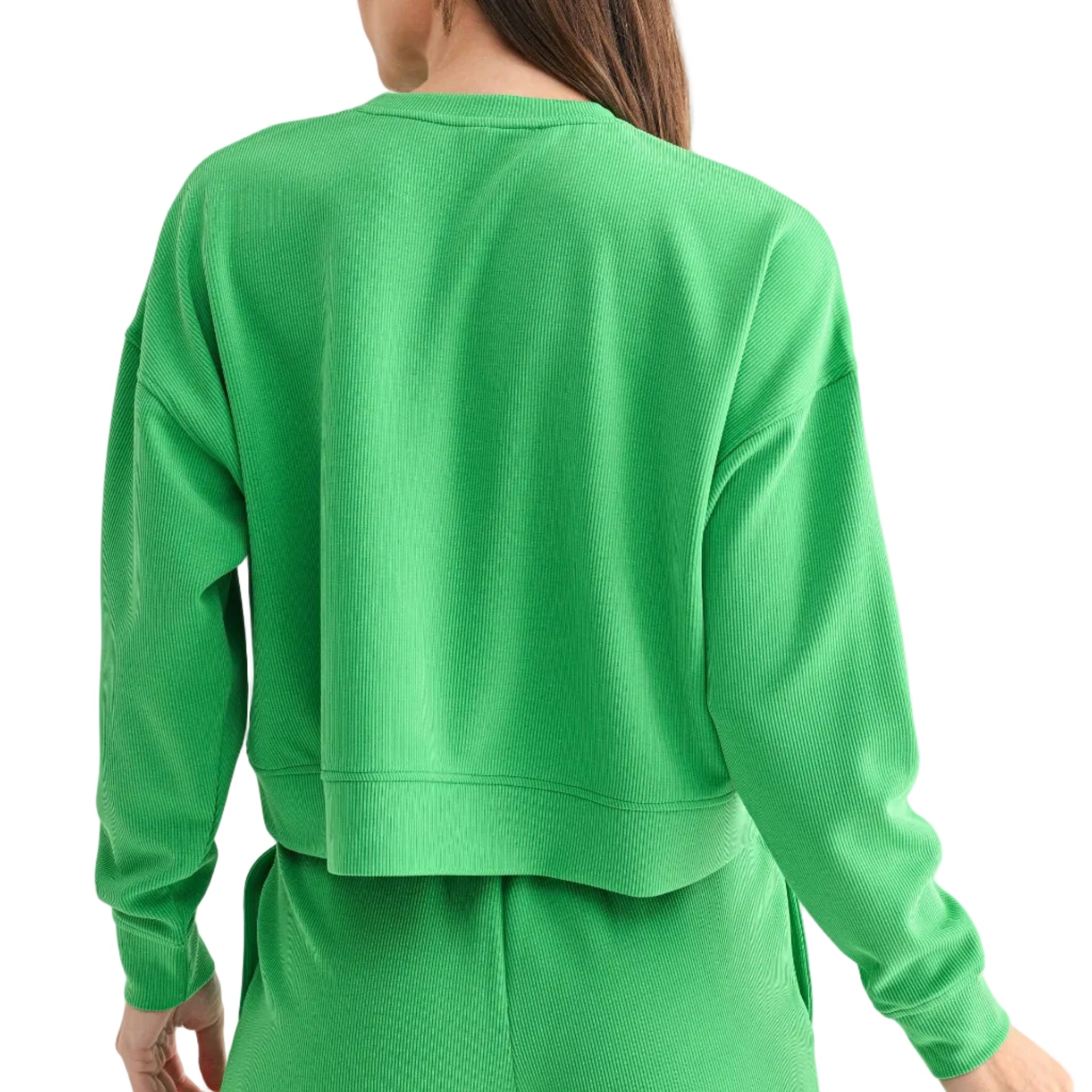 Person wearing a green sweatshirt and shorts set on a white background