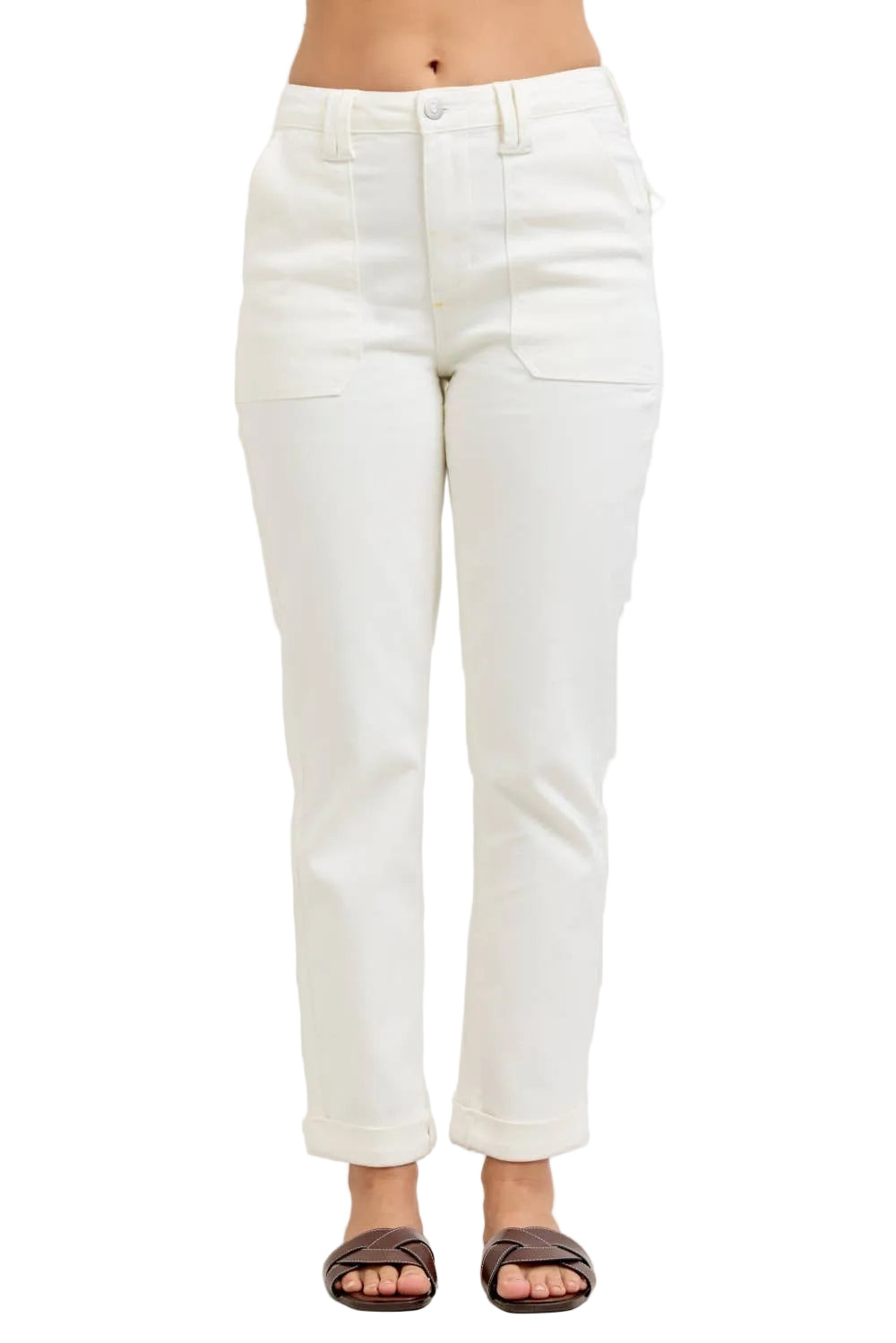 White jeans worn by a person on a plain background