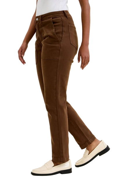 Brown pants worn by a person on a plain background