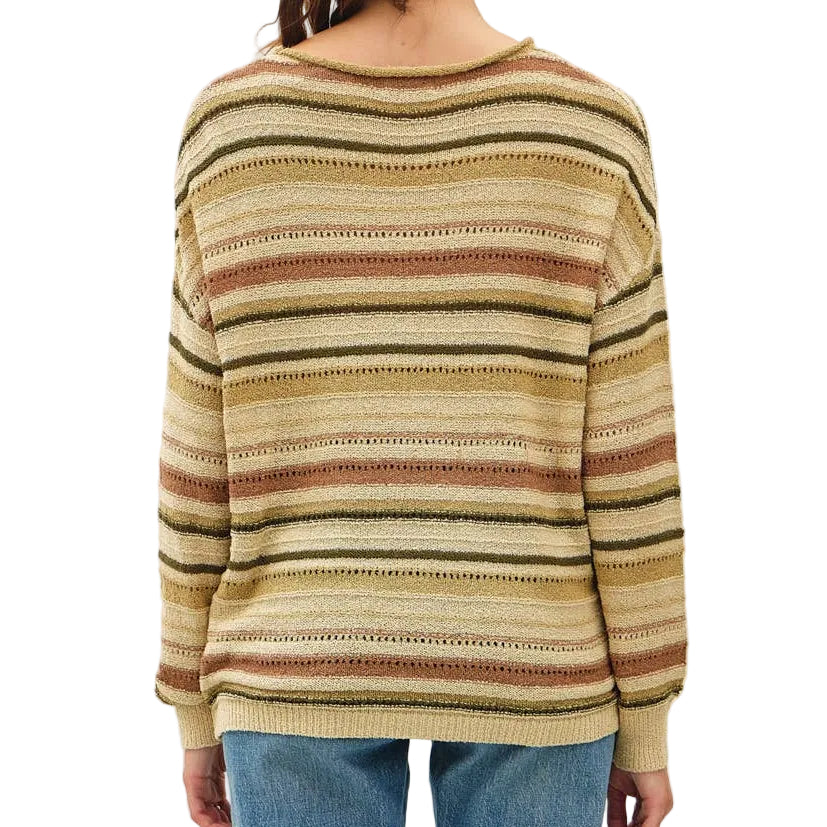 Person wearing a striped sweater and blue jeans against a white background