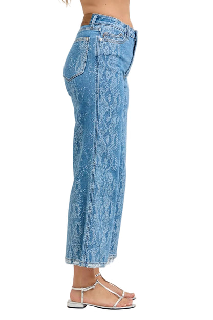 Blue acid-wash jeans worn by a person on a white background