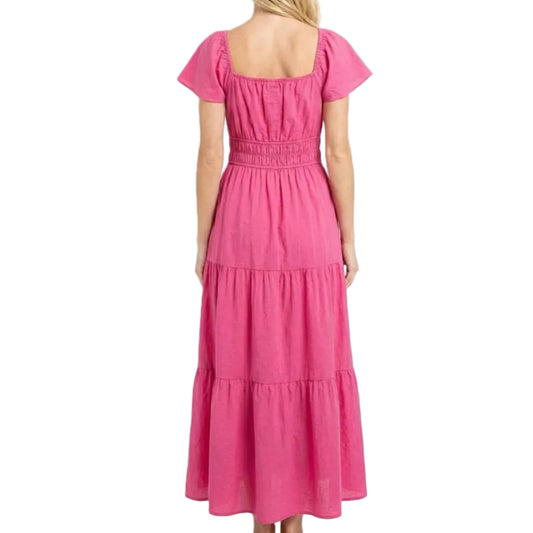 Woman wearing a pink dress on a white background