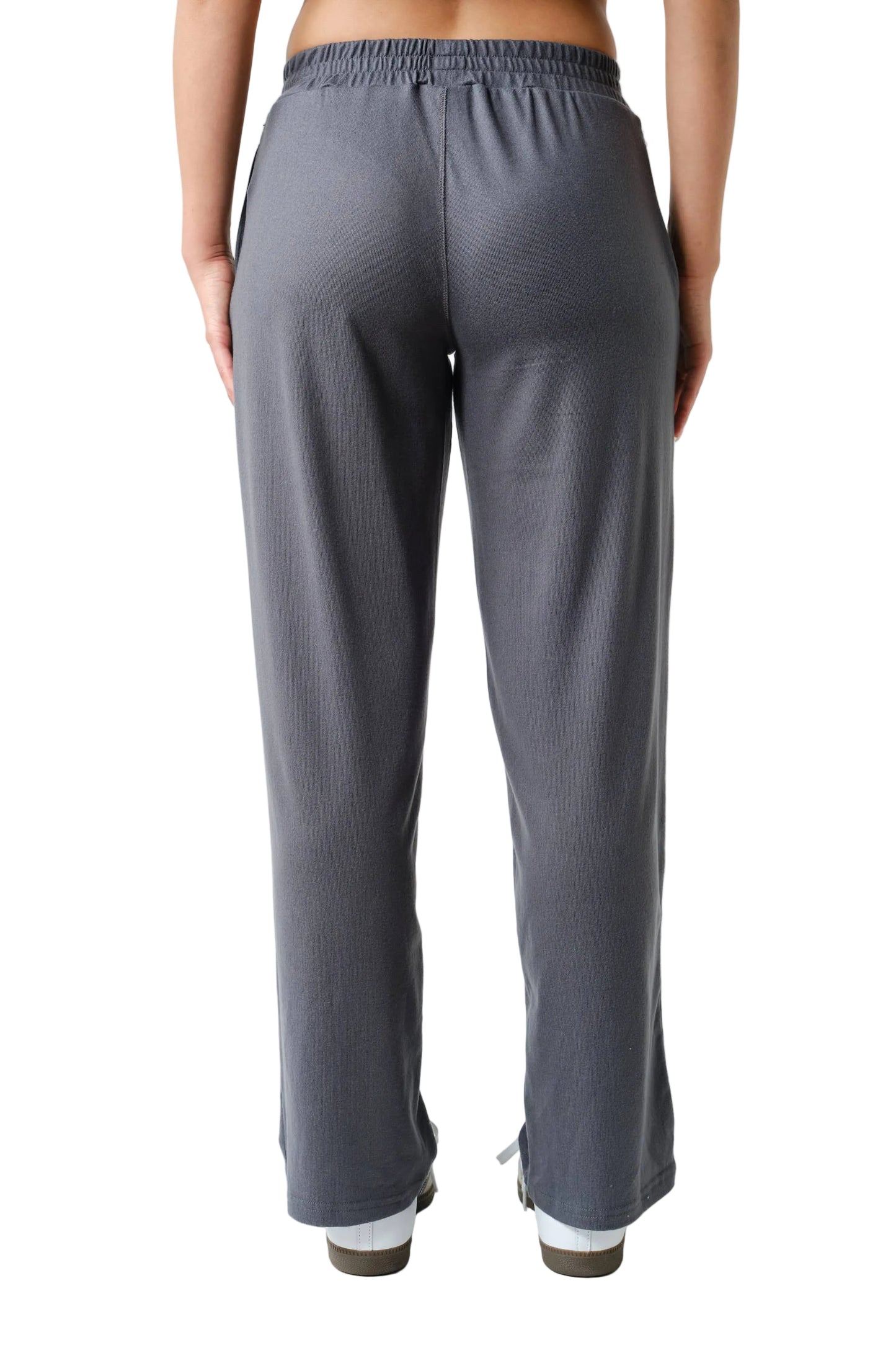 Person wearing gray pants on a white background