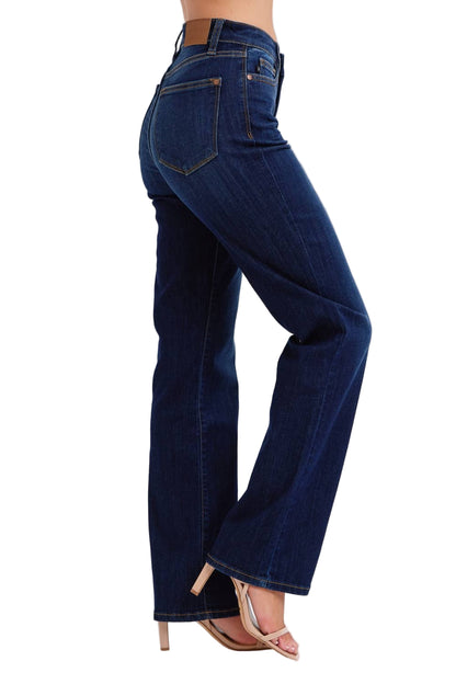 Blue jeans worn by a person on a white background