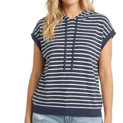 Woman wearing a navy and white striped hoodie with a plain background