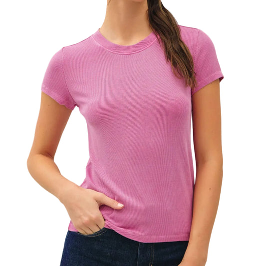 Woman wearing a pink t-shirt against a plain background