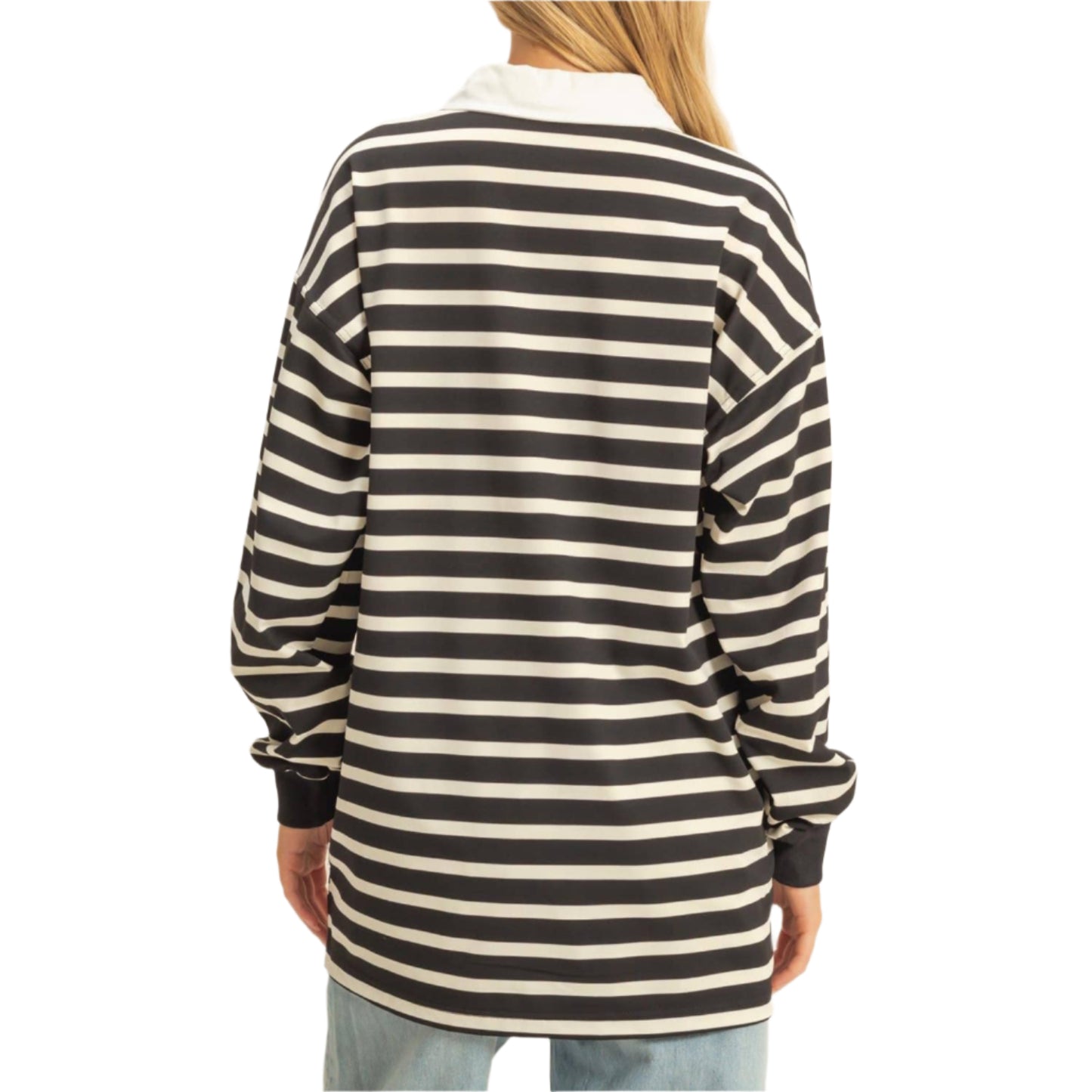 Person wearing a black and white striped long-sleeve shirt on a beige background