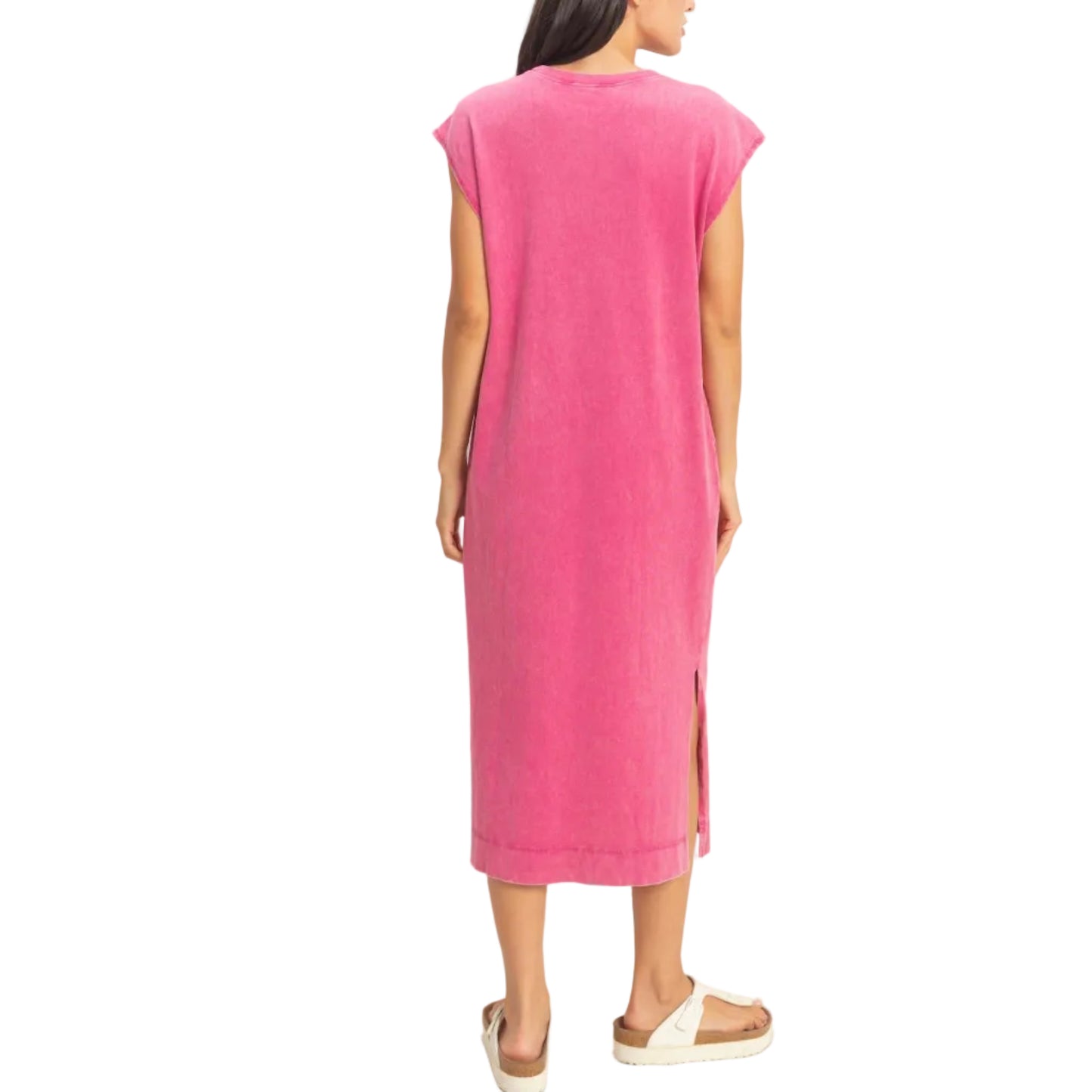 Woman wearing a pink dress with a white background