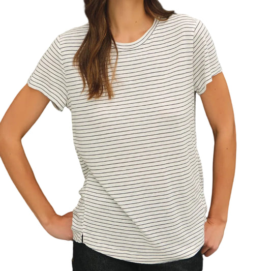 Woman wearing a striped t-shirt against a black background