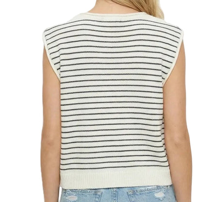 Person wearing a striped sleeveless top and light blue jeans on a white background