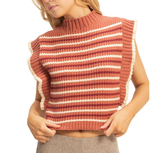 Woman wearing a striped ribbed sweater vest against a plain background