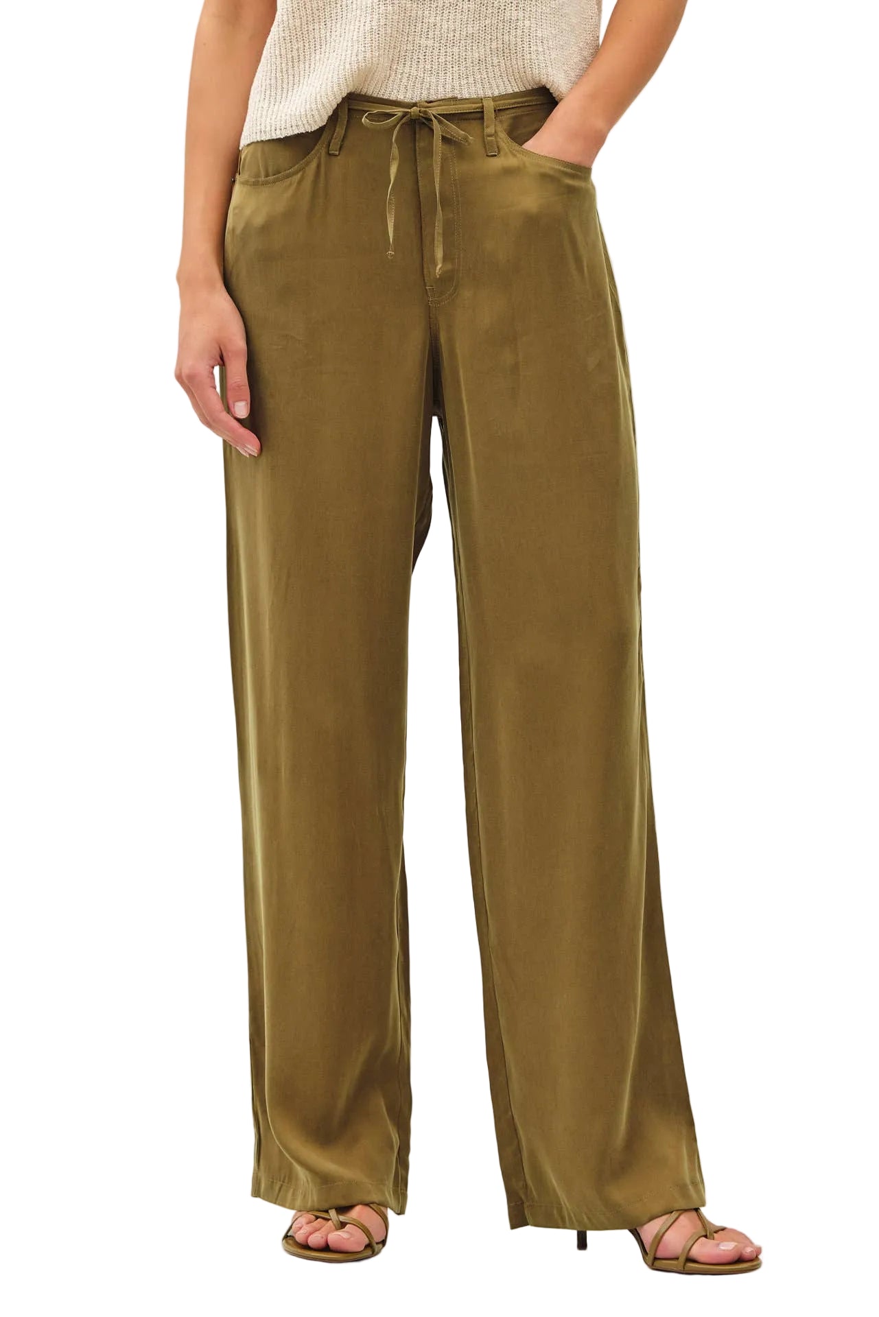 Person wearing olive green wide-leg pants on a white background