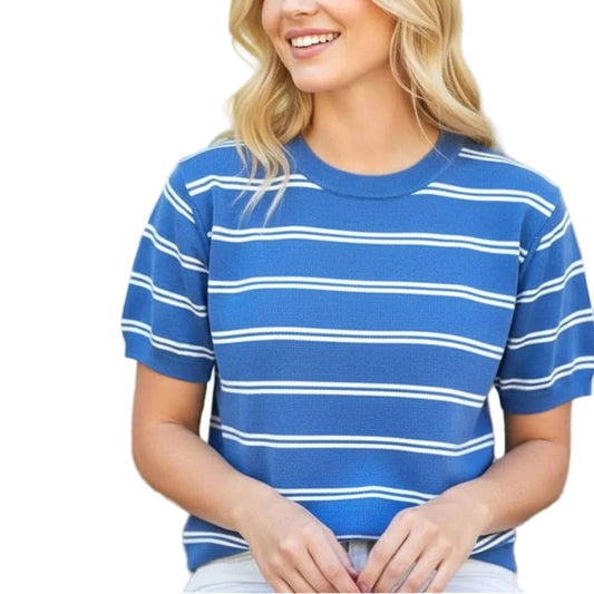 Woman wearing a blue and white striped shirt outdoors