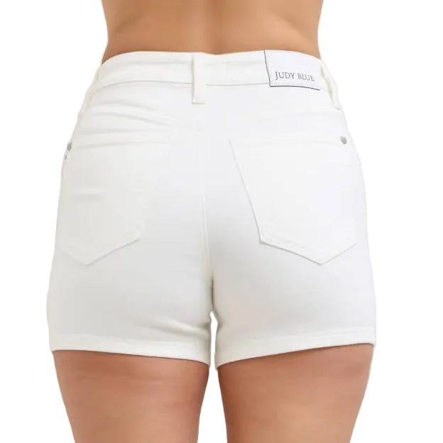 White shorts worn by a person on a plain background