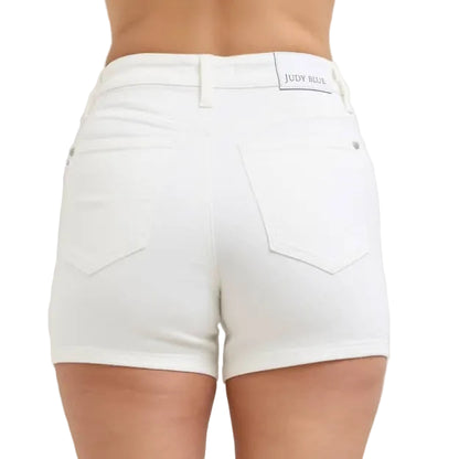 White shorts worn by a person on a plain background