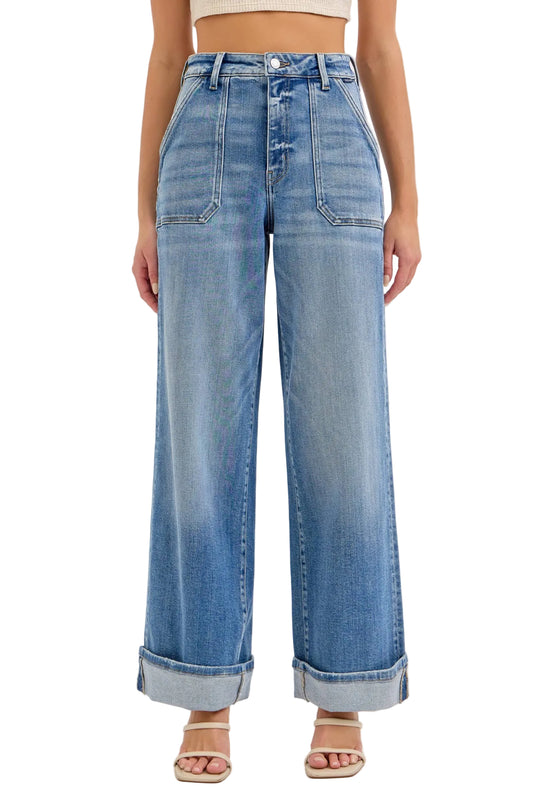 Wide-leg jeans worn by a person on a light gray background