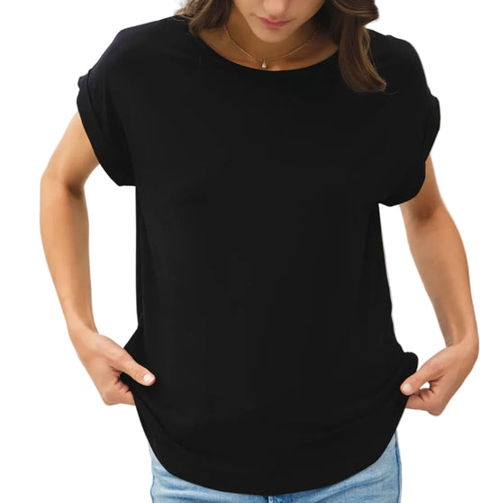 Woman wearing a black t-shirt and blue jeans against a white background