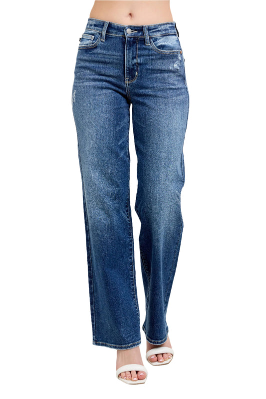 Blue jeans worn by a person on a light gray background