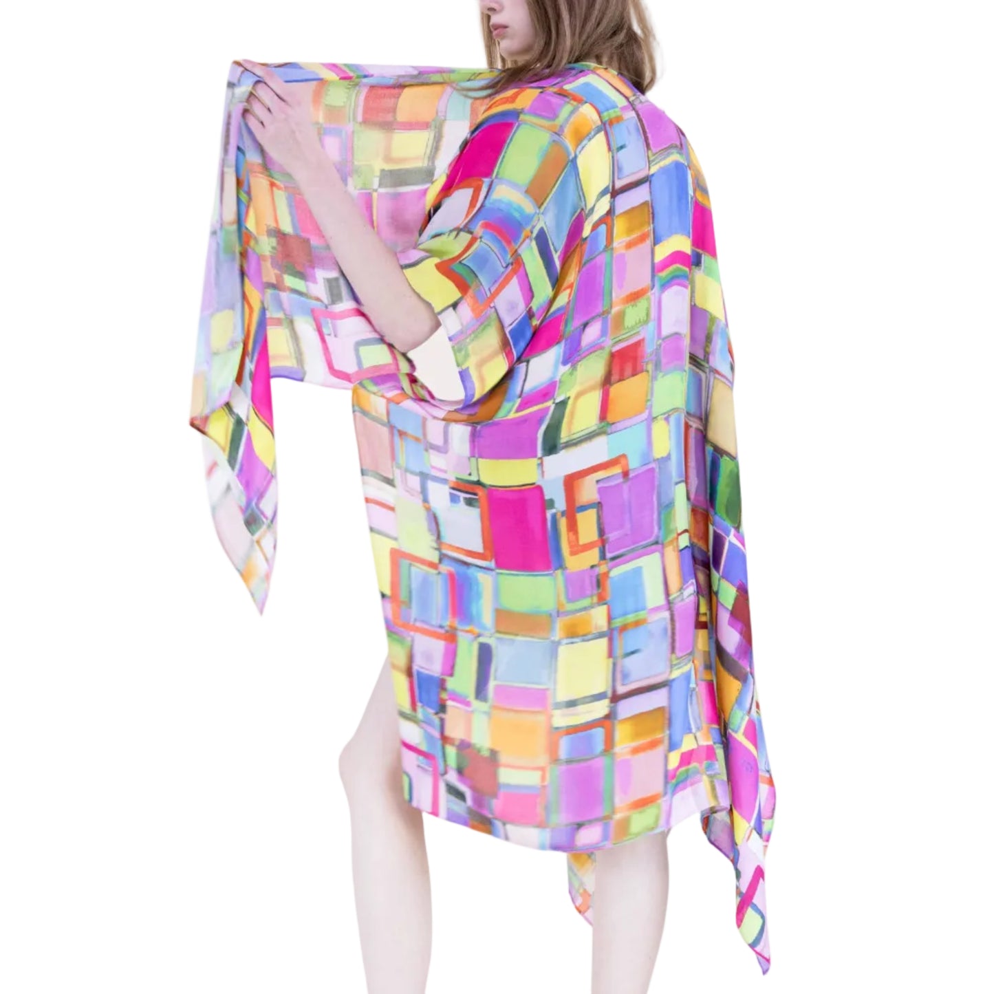 Woman holding a colorful checkered fabric against a white background
