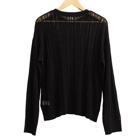 Black long-sleeve top on a hanger against a light gray background