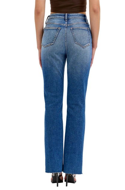 Blue jeans worn by a person on a white background