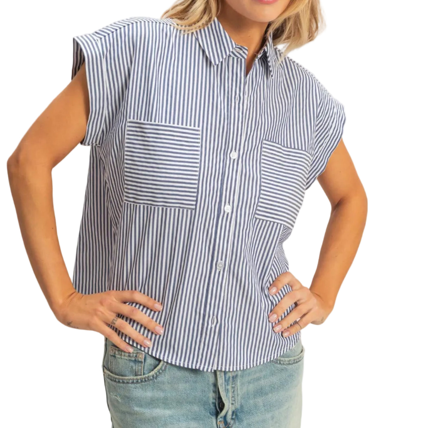 Woman wearing a sleeveless striped shirt and denim skirt on a plain background