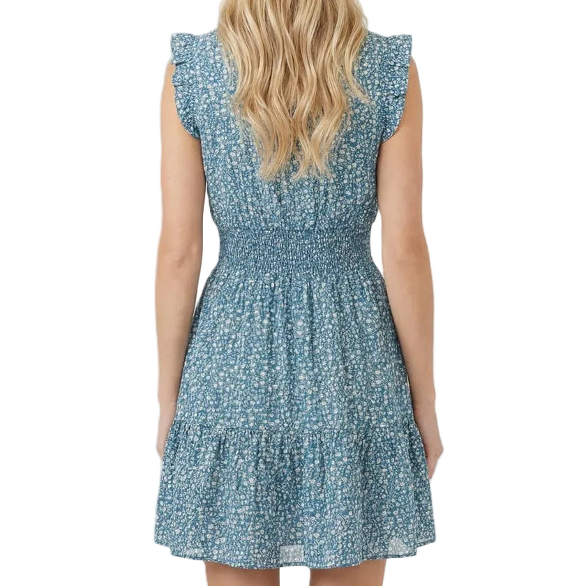 Woman wearing a blue floral dress on a white background