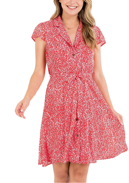 Woman wearing a red floral dress against a white background