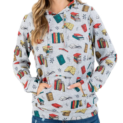Woman wearing a hoodie with book pattern on a white background