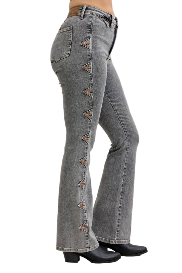 Gray flared jeans with decorative studs on a white background