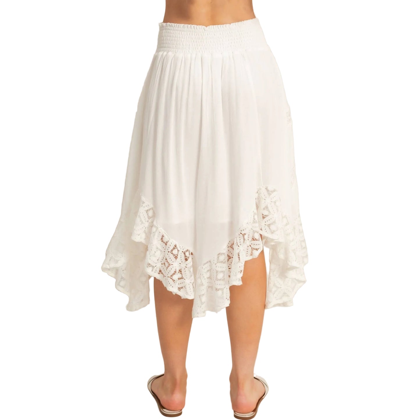 White lace-trimmed skirt on a plain background