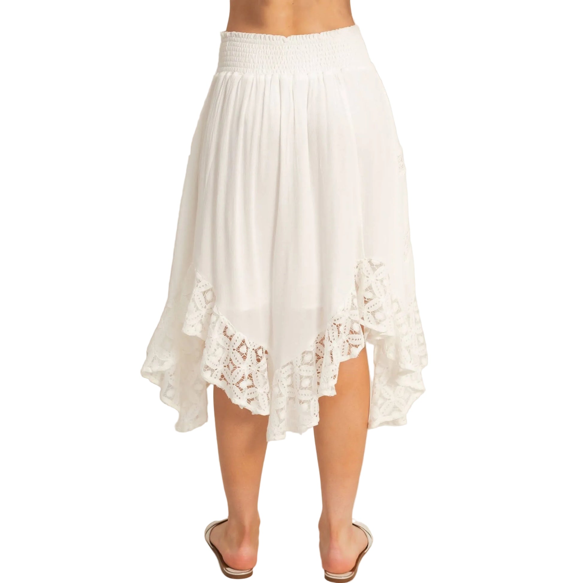 White lace-trimmed skirt on a plain background