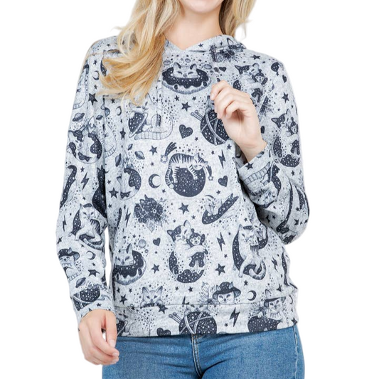 Woman wearing a patterned sweater with a white background