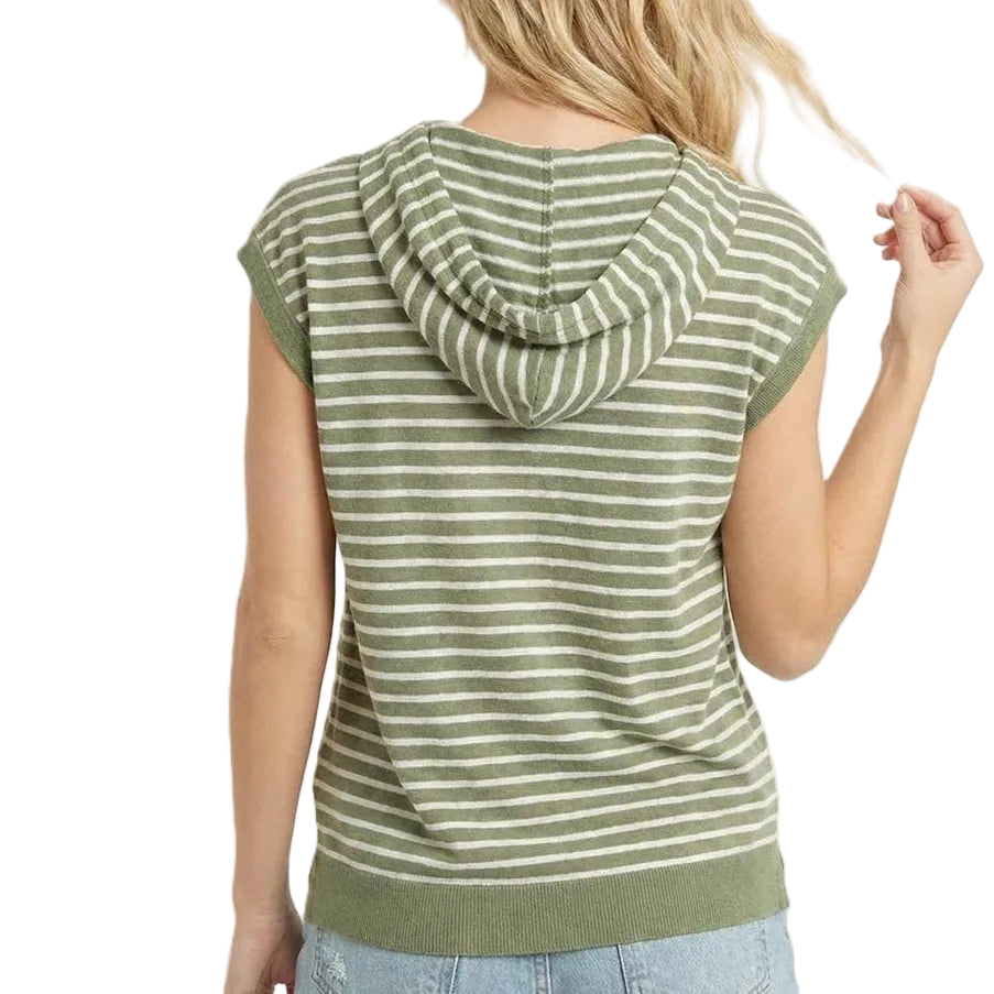 Woman wearing a green and white striped hoodie with a plain background