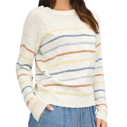 Woman wearing a striped sweater with a black background