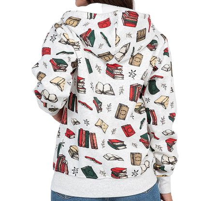 Woman wearing a white hoodie with book-themed design on a plain background